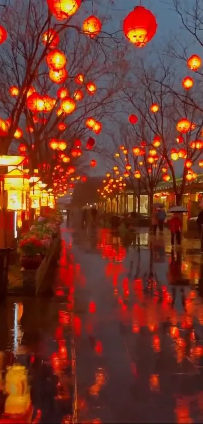 Lantern-lit street at night with reflections on wet pavement.