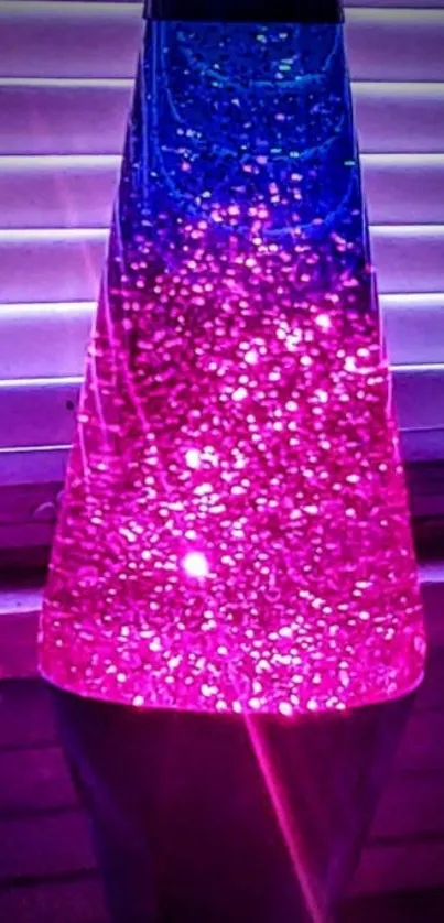 Vibrant pink and blue lava lamp glowing.