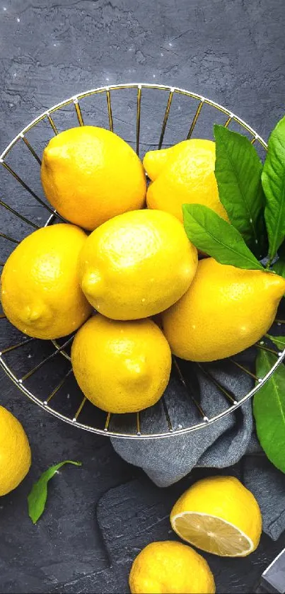 Vibrant yellow lemons in a wire basket with leafy greens.