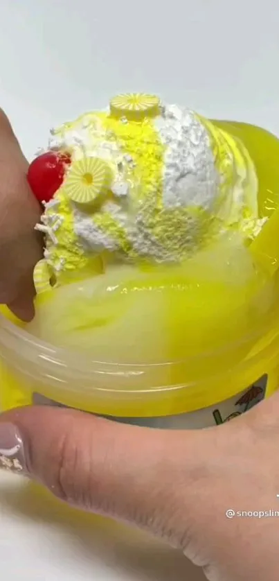 Lemon ice cream slime in vibrant yellow hues as mobile wallpaper.