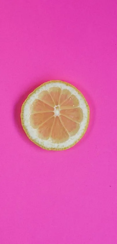 Vibrant lemon slice on hot pink background wallpaper.