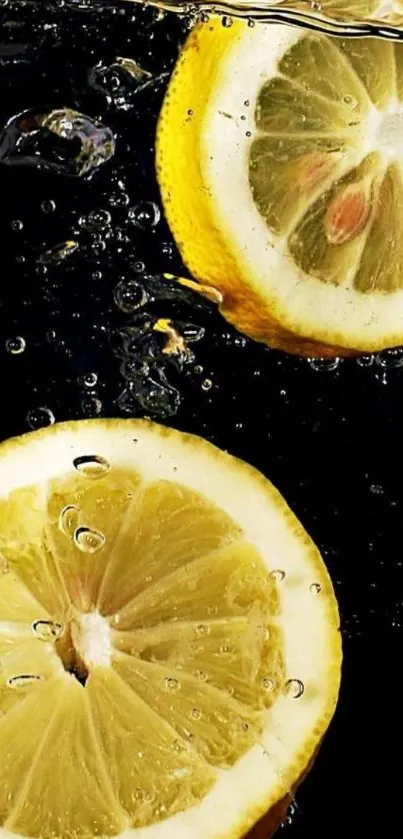 Vibrant lemons splash in water on dark background wallpaper.