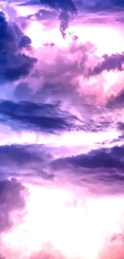 Dramatic scene of lightning in purple storm clouds wallpaper.