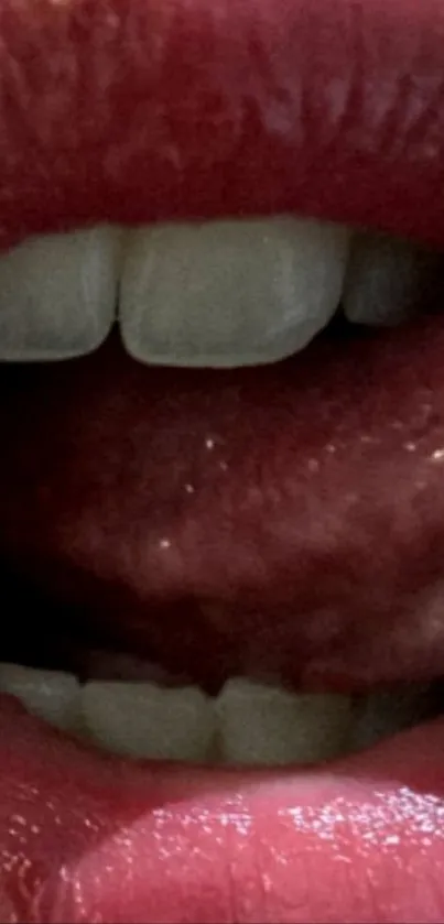 Close-up image of vibrant lips with glossy red color.