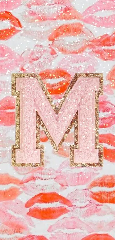 Lip print and letter M wallpaper in pink and coral hues.