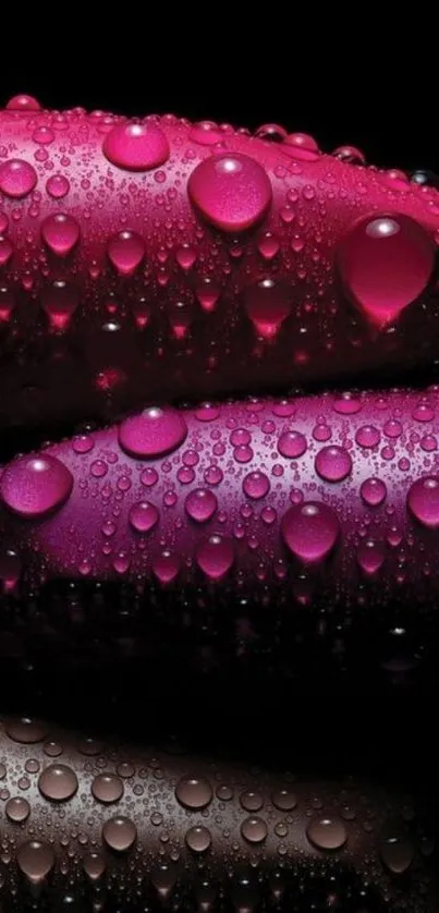 Pink lipsticks with water droplets on a black background.