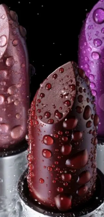 Three lipsticks with water droplets on black background.