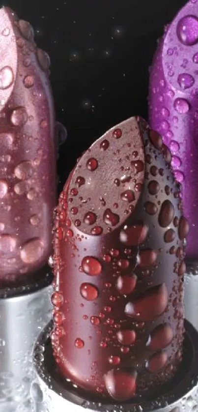 Three vibrant lipsticks with water droplets, showcasing pink, red, and purple hues.