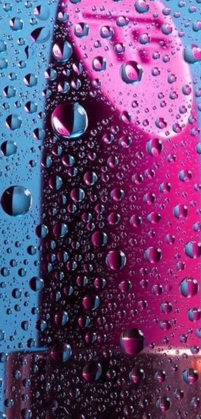 Pink lipstick with water droplets against a blue background.