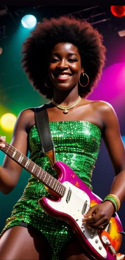 Musician in a green dress playing guitar on a colorful stage.