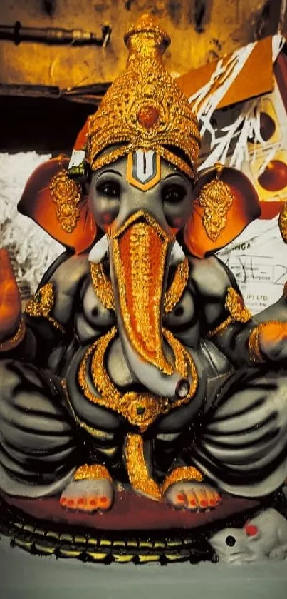 Vibrant statue of Lord Ganesha with golden adornments.