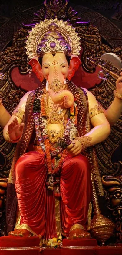 Vibrant image of Lord Ganesha adorned in red with intricate details and spiritual symbols.