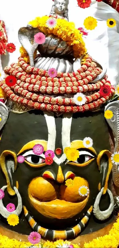 Colorful Lord Shiva decoration with marigold garlands and divine offerings.