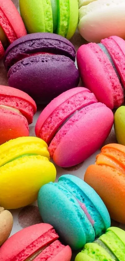 Vibrant, colorful macarons in various bright hues on a phone wallpaper.