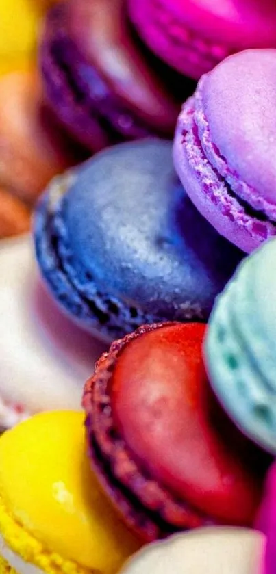 A vibrant assortment of colorful macarons stacked closely together.