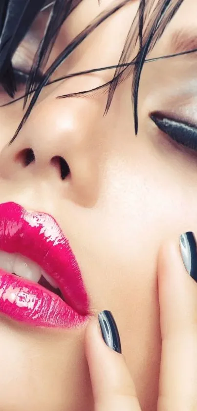 Close-up of vibrant makeup with bold pink lips and striking black eyeliner.