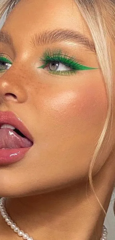 Vibrant makeup with bold green accents on mobile wallpaper.