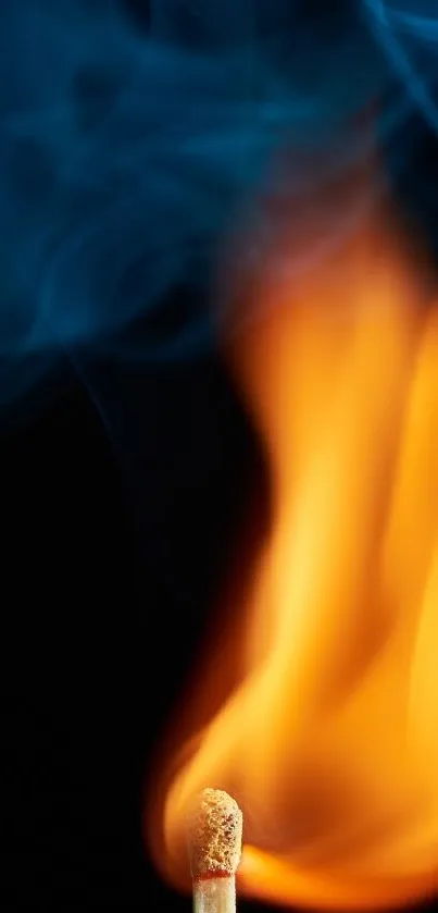 Vibrant matchstick flame with blue smoke on a dark background.