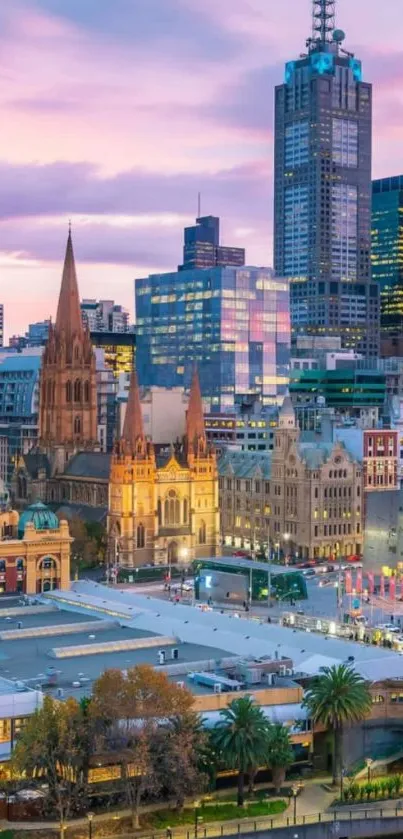 Melbourne cityscape with vibrant pink sunset sky and architectural buildings.