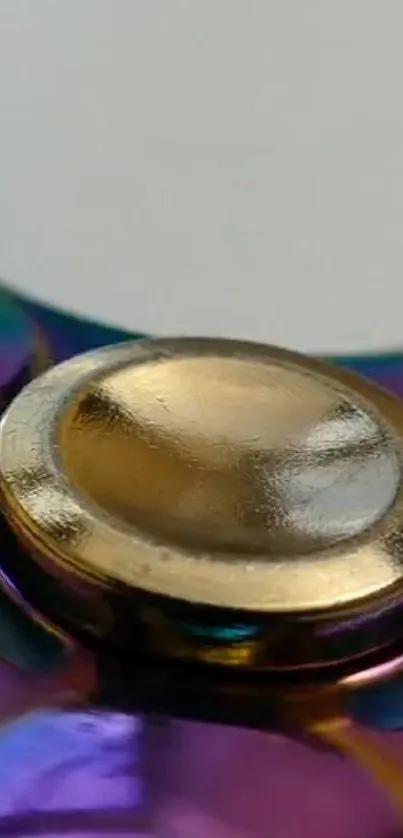 Colorful metal spinner with gold center.