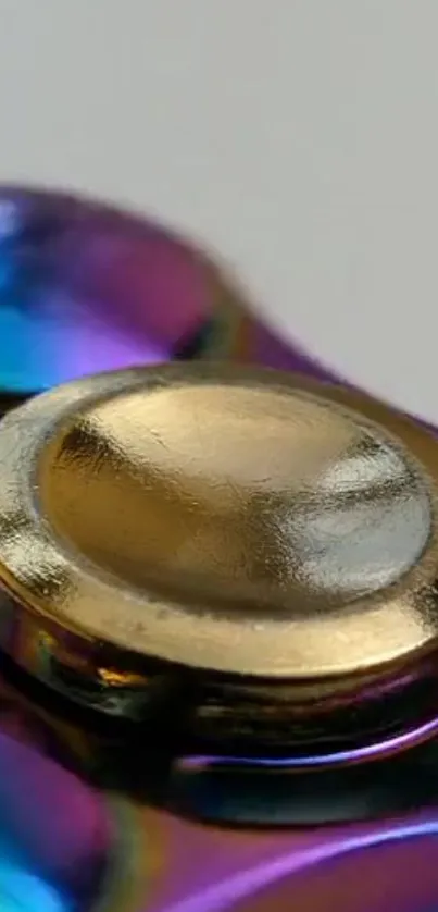 A close-up of a vibrant metallic spinner with a golden center.