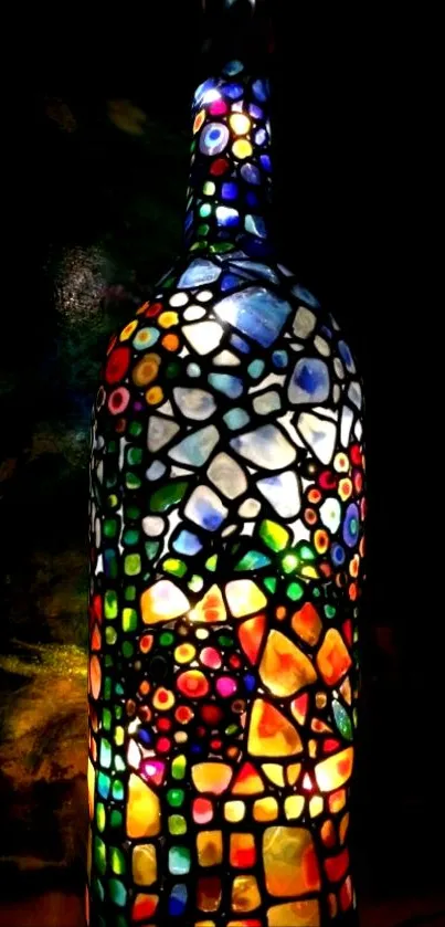 Mosaic stained glass bottle art in vibrant colors.