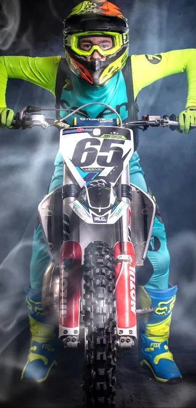 Motocross biker in neon gear with smoky background on a mobile wallpaper.