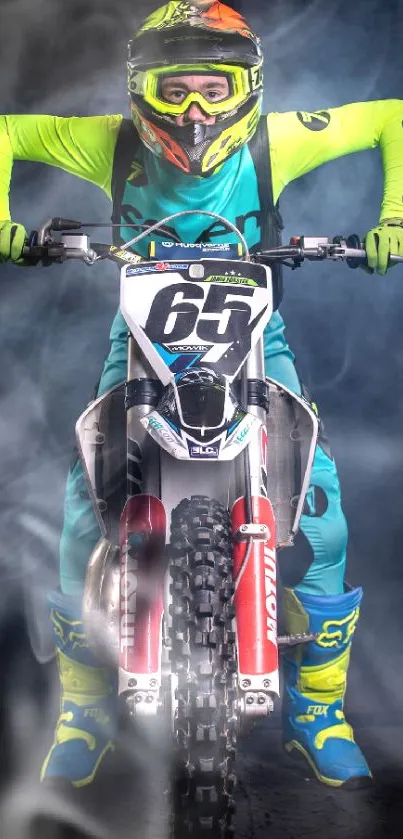 Motocross rider in vibrant neon gear on bike facing forward.