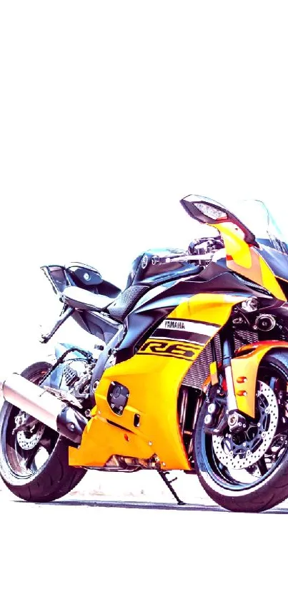 Sleek yellow sportbike under a blue sky.