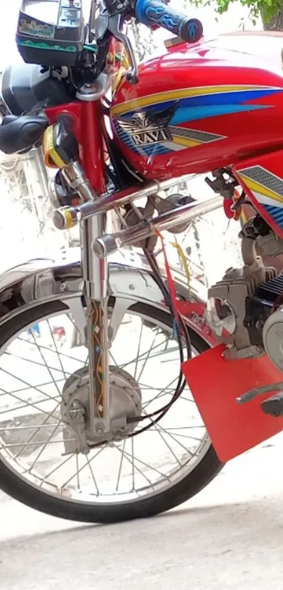 Vibrant red motorcycle with colorful stripes and chrome details.