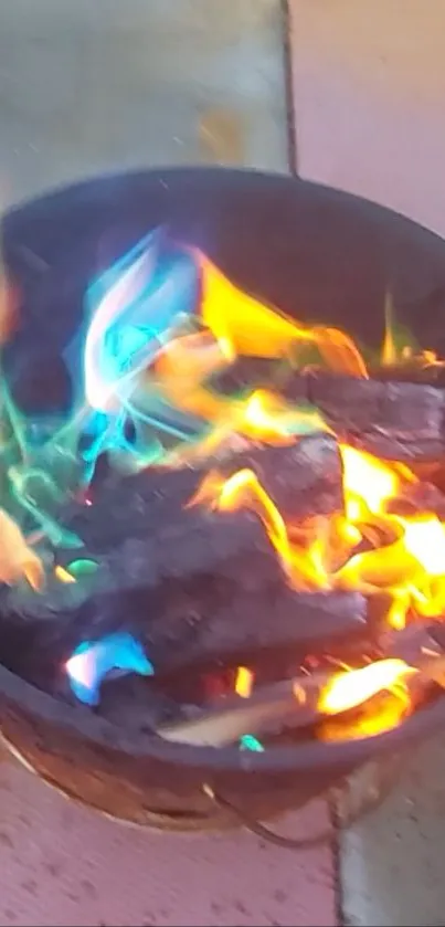 Vibrant fire with multicolored flames, featuring blue, orange, and green hues.