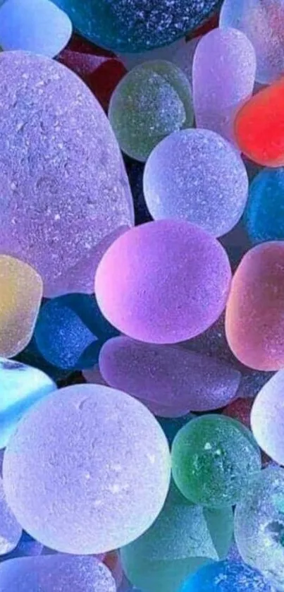 A mobile wallpaper featuring colorful, translucent pebbles.