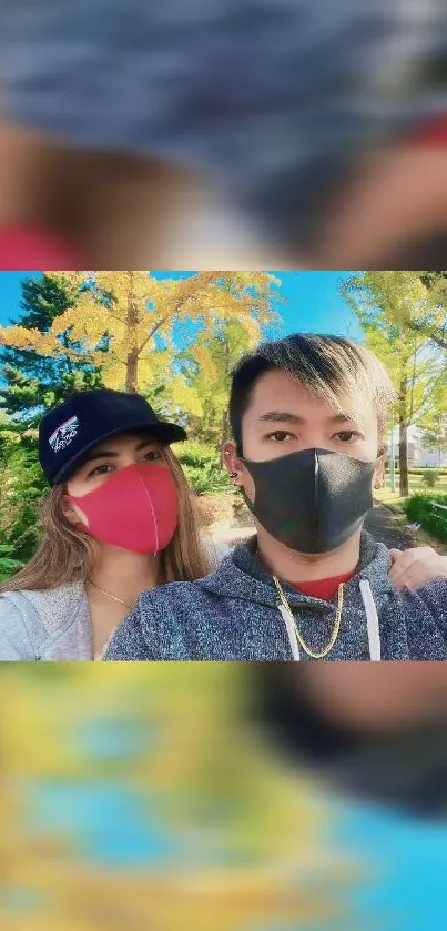 Vibrant nature walk wallpaper with two people wearing masks.