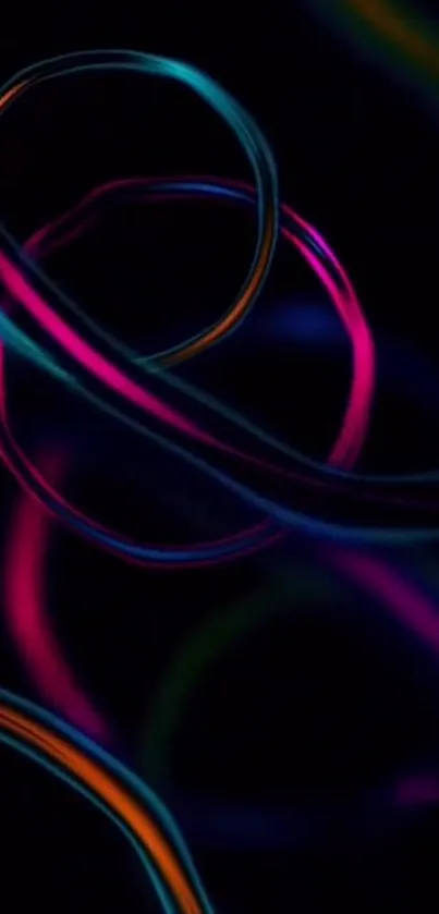 Vibrant neon abstract wallpaper with colorful swirling lines on a black background.