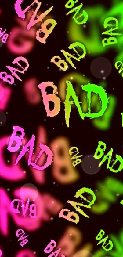 Mobile wallpaper with vibrant neon 'BAD' text in pink and green on dark background.