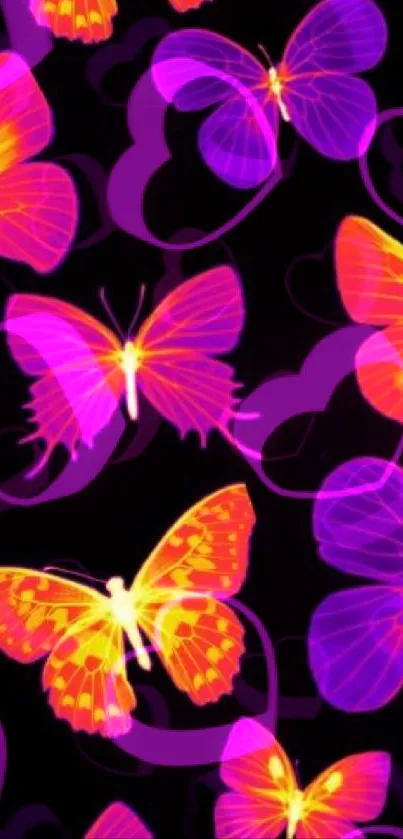 Vibrant neon butterflies on a black background wallpaper.