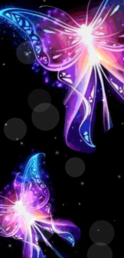 Colorful neon butterflies on a dark background wallpaper.