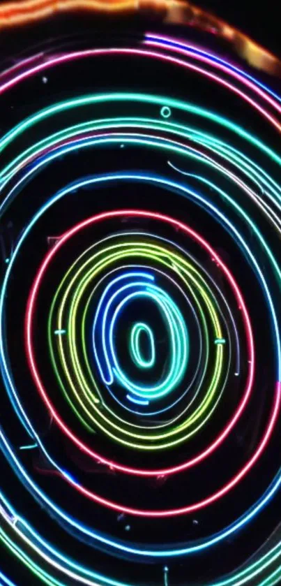 Vibrant neon circles creating a colorful abstract design on a dark background.