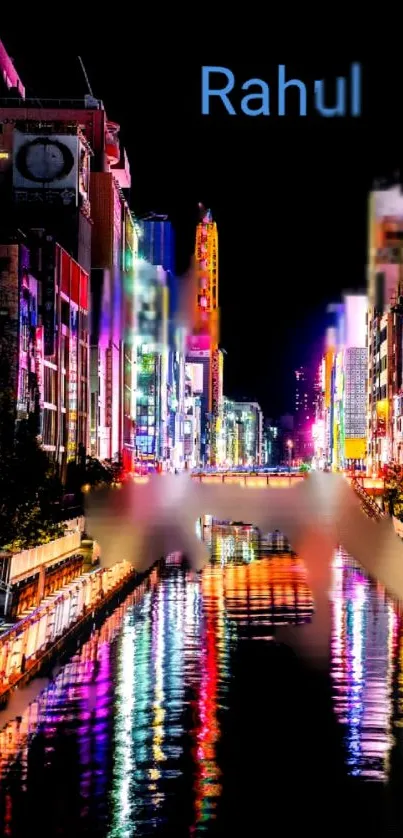 Vibrant neon cityscape wallpaper with colorful reflections on the water at night.