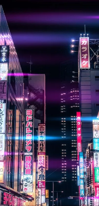 Vibrant Tokyo street illuminated with neon lights at night.