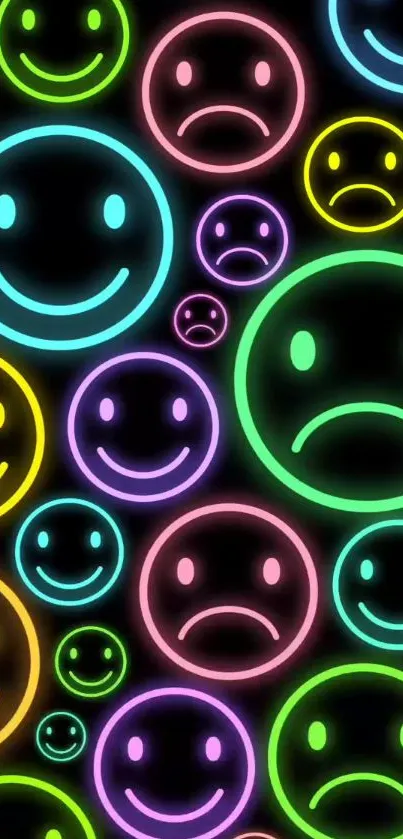 Vibrant neon emoji wallpaper with colorful happy and sad faces on a black background.