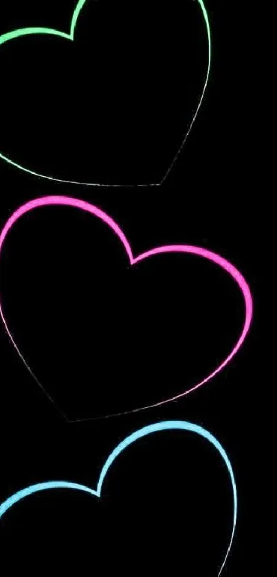 Vibrant neon hearts on a black background wallpaper.