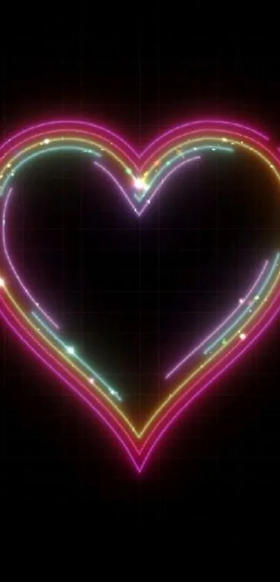 Vibrant neon heart design glowing against a black background.