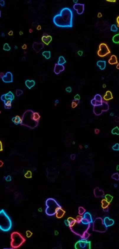 Colorful neon hearts wallpaper on black background.