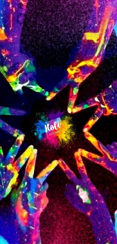 Neon-painted hands forming a star in darkness.