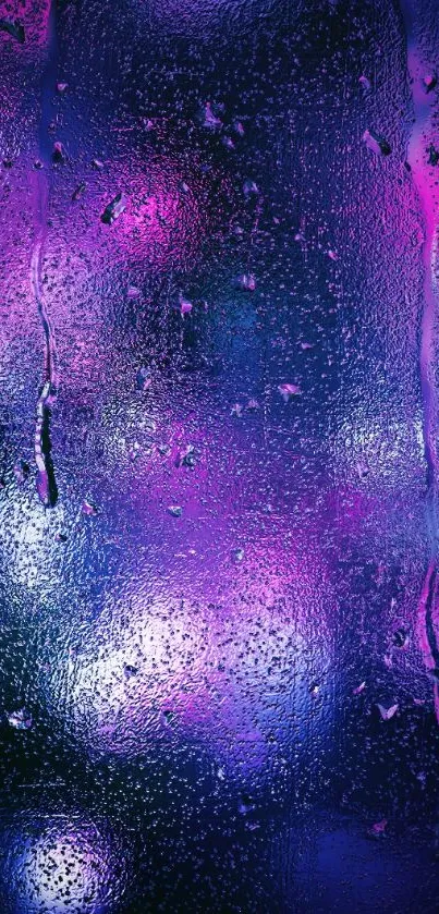 Vibrant neon raindrop wallpaper with purple and blue bokeh effect.