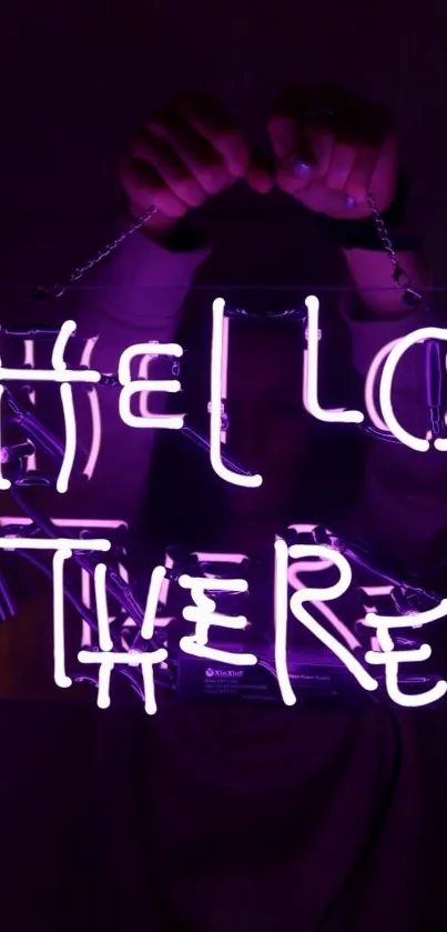 Neon sign reading 'Hello There' in bright purple glow.