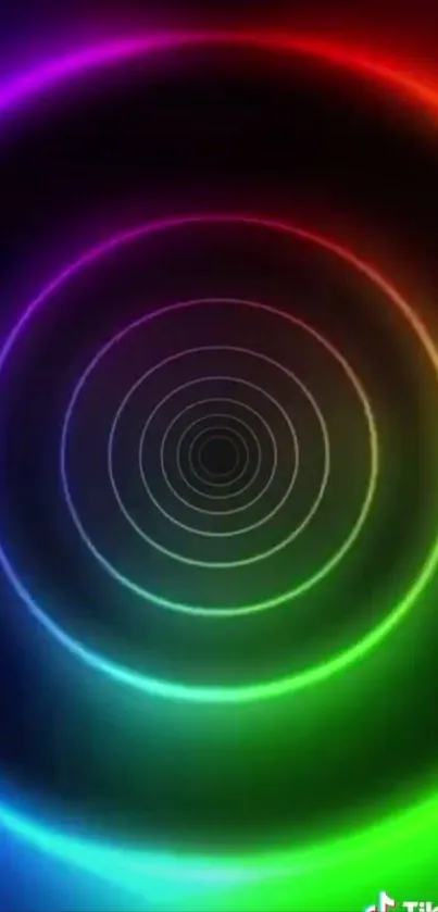 Vibrant neon spiral wallpaper with rainbow circles