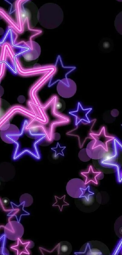 Vibrant neon star wallpaper with pink and purple stars on a black background.