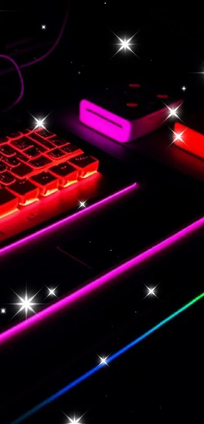 A vibrant neon-lit tech setup with hot pink and red hues.